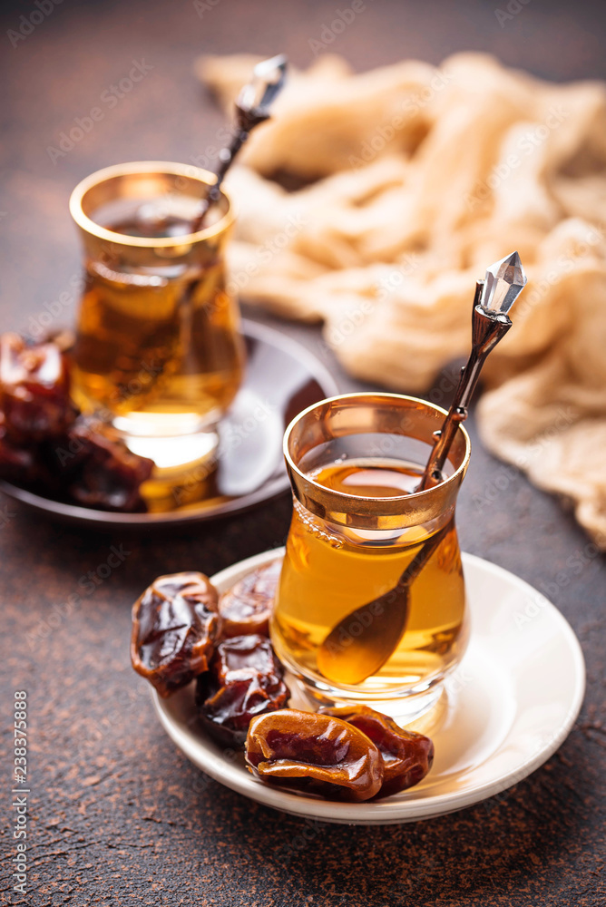 Traditional arabic tea and dry dates Traditional arabic tea and dry dates