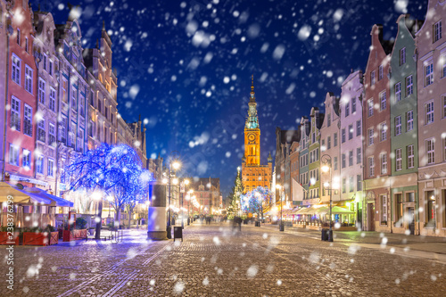 Old town of Gdansk on a cold winter night with falling snow, Poland