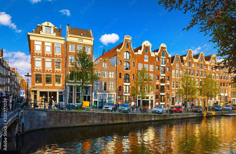 Amsterdam Netherlands. Traditional brown house at coast channel