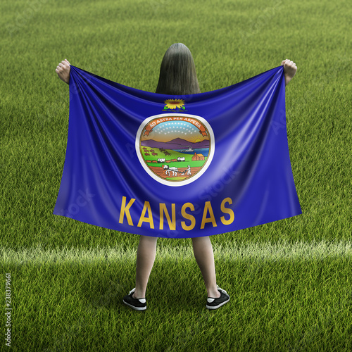 Women and Kansas flag
