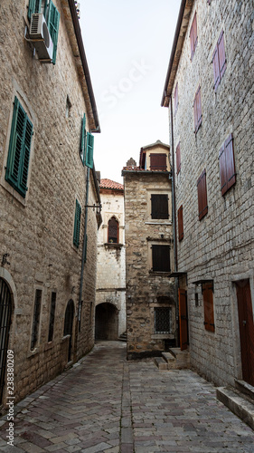 Beautiful narrow streets of the old European city. stone paved paths. © Dmitry Dven