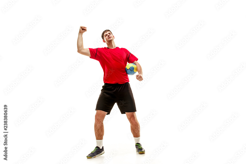 The happy fit caucasian young male handball player at studio on white background. Win, winner, human emotions concept