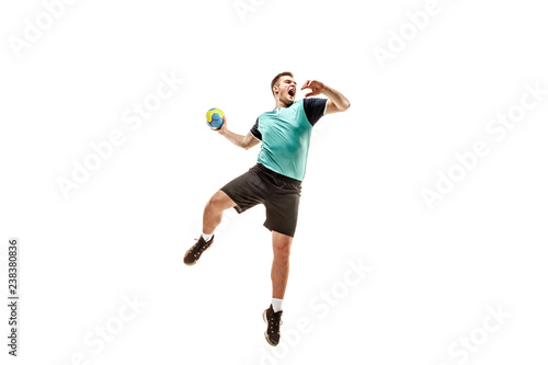Fototapeta The fit caucasian young male handball player at studio on white background