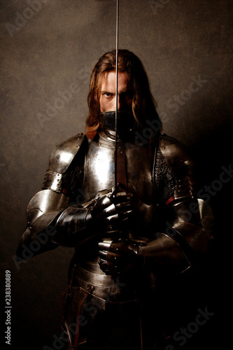 Portrait of a knight in armor on guard