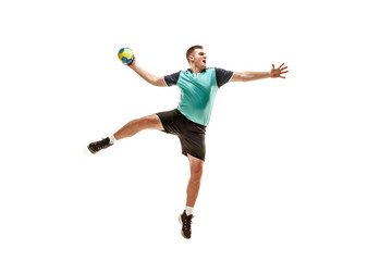 The fit caucasian young male handball player at studio on white background. Fit athlete isolated on white. The man in action, motion, movement. attack and defense concept