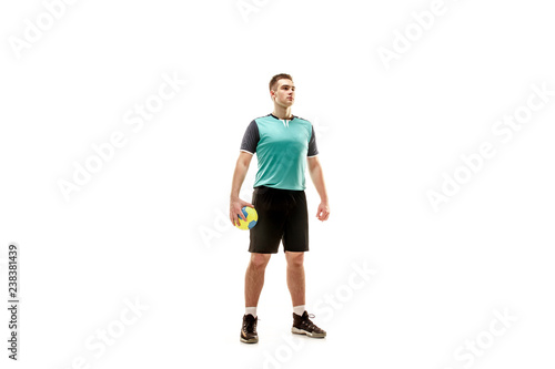 The fit caucasian young male handball player at studio on white background