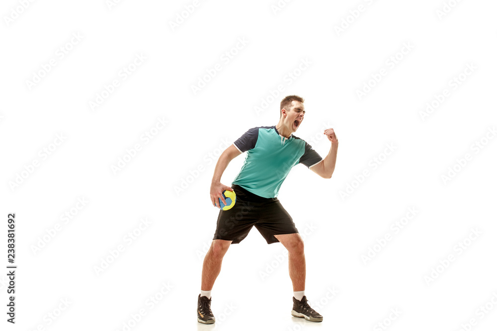 The happy fit caucasian young male handball player at studio on white background. Win , winner , human emotions concept The happy fit caucasian young male handball player at studio on white background. Win , winner , human emotions concept