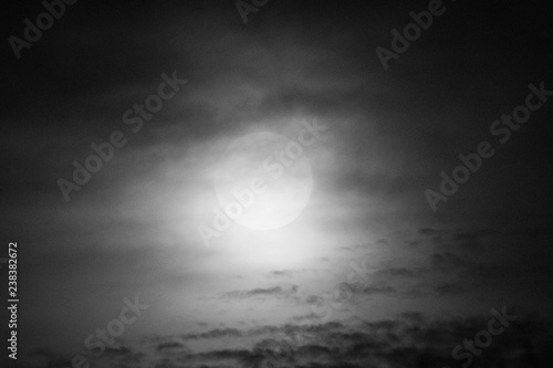 Full Moon and clouds on the night sky © RLS Photo