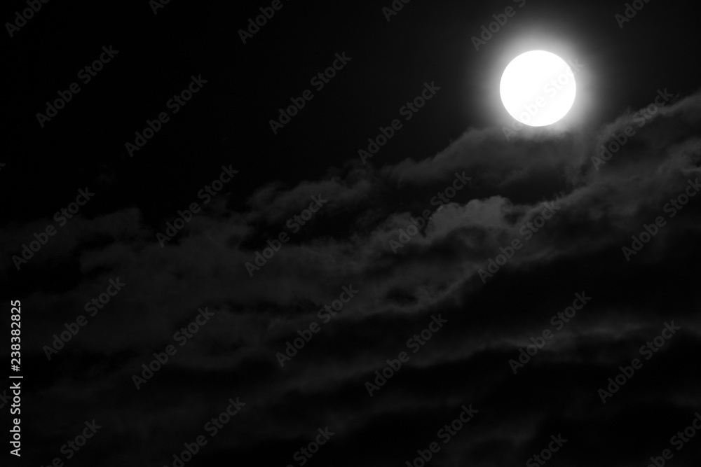 Full Moon and clouds on the night sky Full Moon and clouds on the night sky