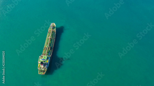 Oil tanker, gas tanker in the high sea.Refinery Industry cargo ship,aerial view,Thailand, in import export, LPG,oil refinery, Logistics and transportation with working crane bridge in harbor © MAGNIFIER