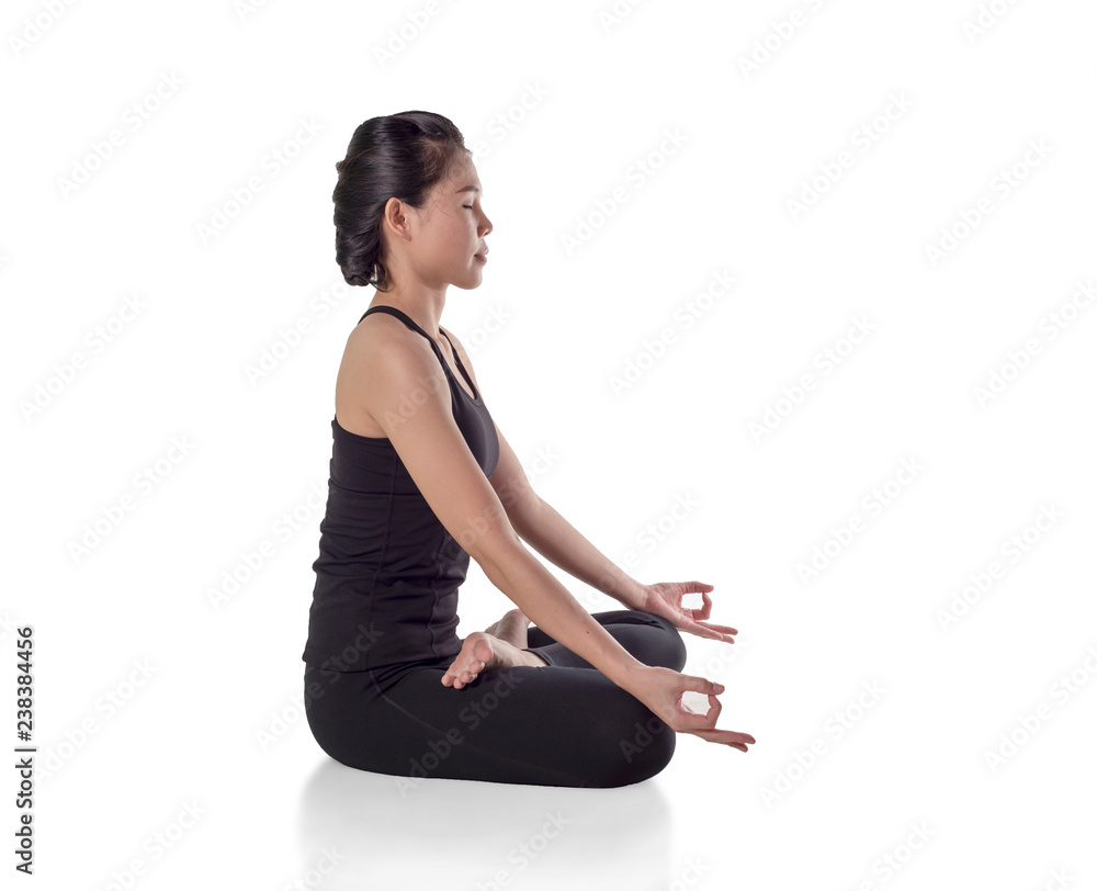 Young attractive woman practicing yoga, sitting in Padmasana exercise, Lotus  pose on meditation session, full length, , closed eyes. Isolated on white  background., with clipping path. Stock Photo