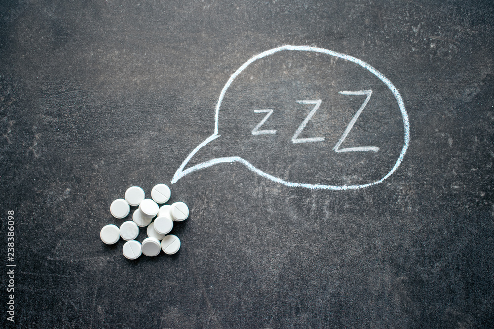 Fotografie White pills in Z shape and text
