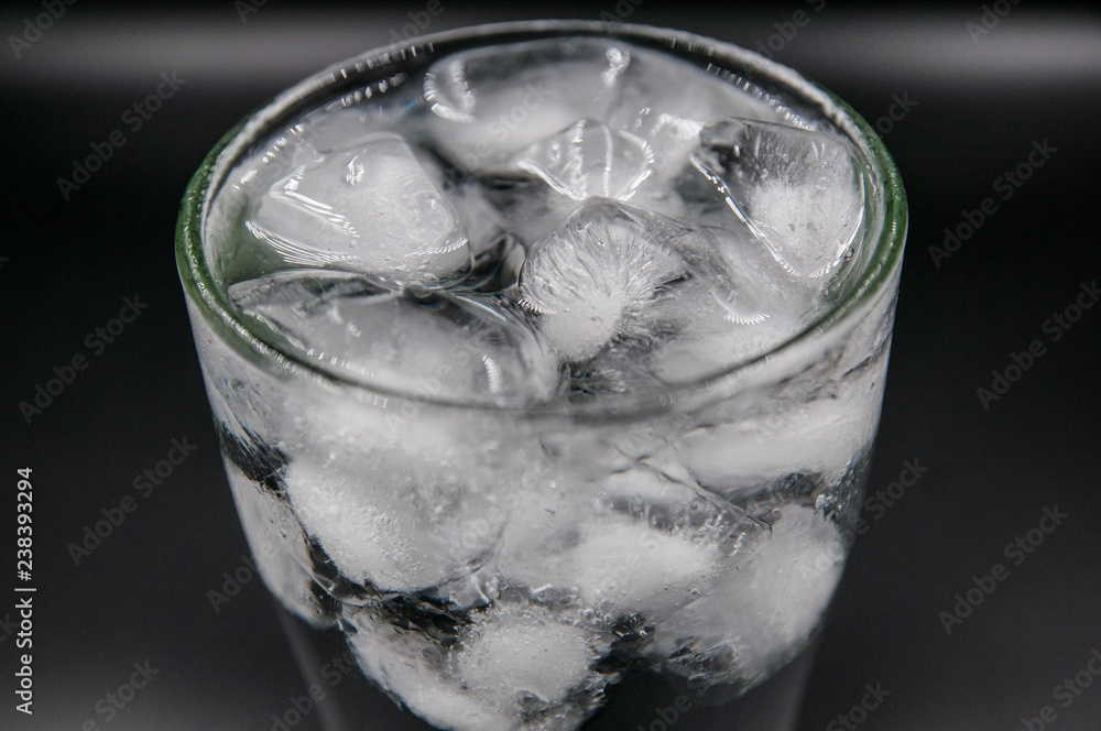 Glass Of Pure Water With Ice Cubes. Isolated On White Background