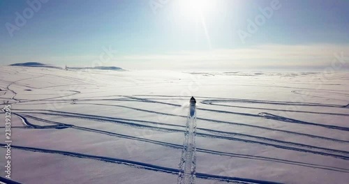 Snomobiling in the tundra.
