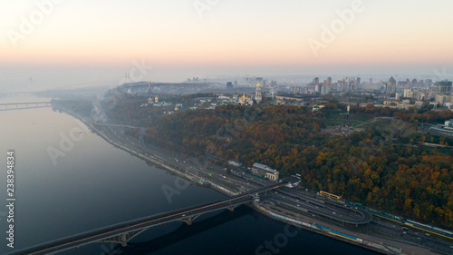Skyline, Kiev city with beautiful morning sky. Pedestrian bridge. Left bank the Dnieper River.