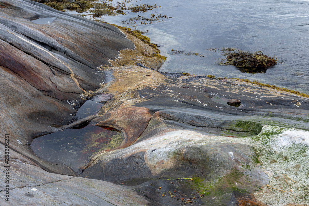 Fototapeta premium Beginning of a pothole created by tidal current in Northern Norway.