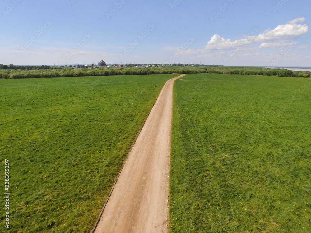 the road to the village from the quadcopter the road to the village from the quadcopter