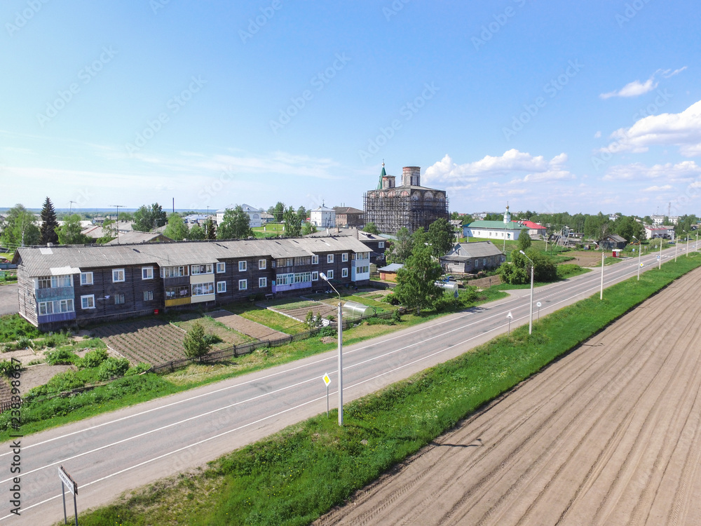 Fototapeta premium the road to the village from the quadcopter