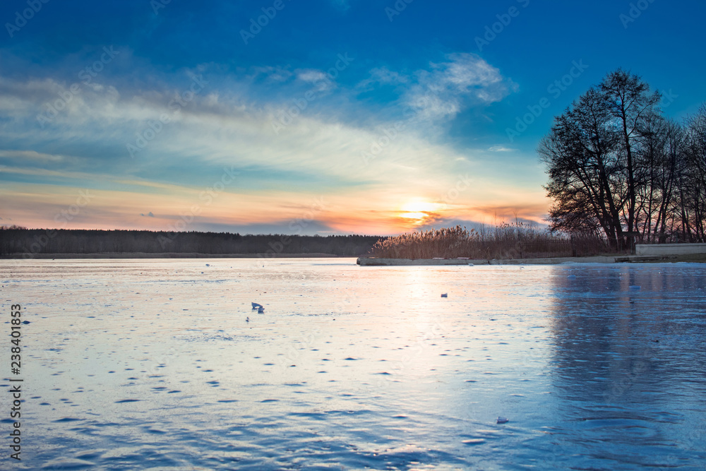 Winter paysage landscape of sunset iced frozen lake river
