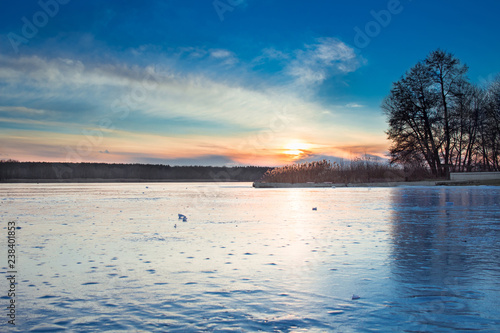 Winter paysage landscape of sunset iced frozen lake river