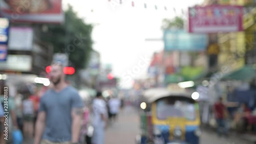 Busy Khao San road with tourist backpackers in Bangkok, Thailand blurred out of focus video
