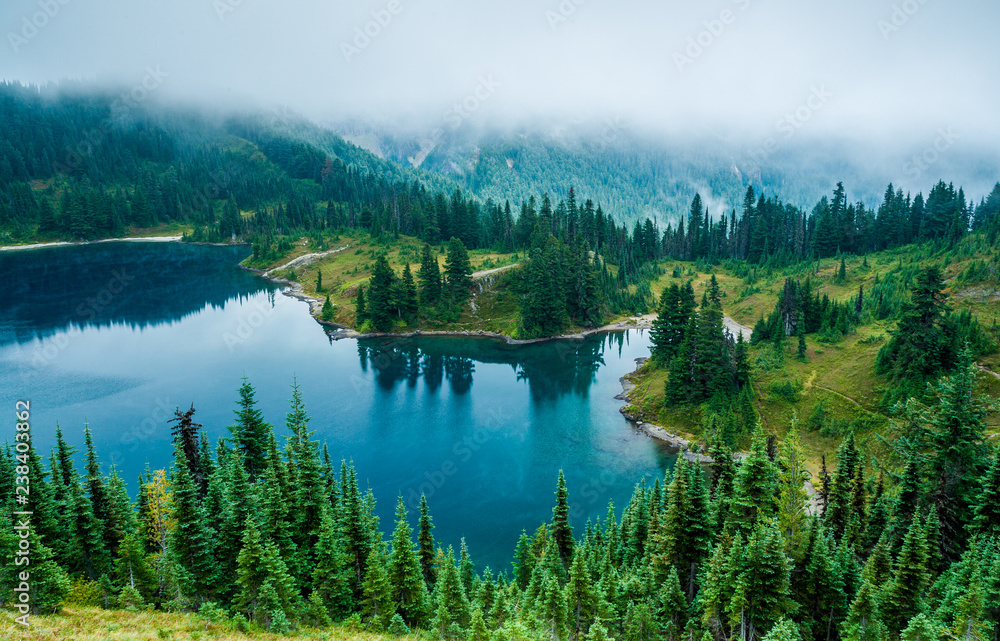 fog over mountain lake fog over mountain lake