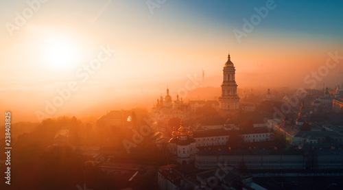 The complex of the Kiev-Pechersk Lavra at dawn covered with smoke