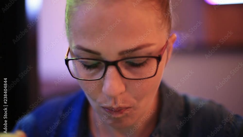business woman at lunch in a cafe using a smartphone.
business woman at lunch in a cafe using a smartphone.