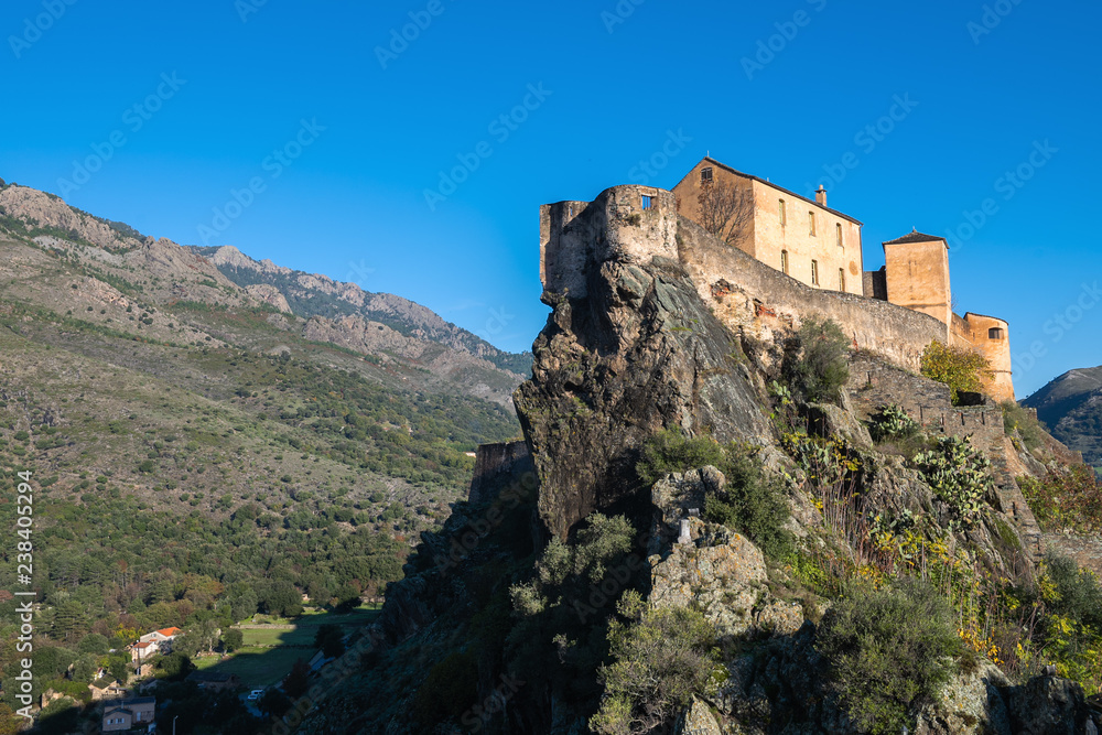View of the historical  citadel in the Corsican city of Corte on a sunny autumn day, France
