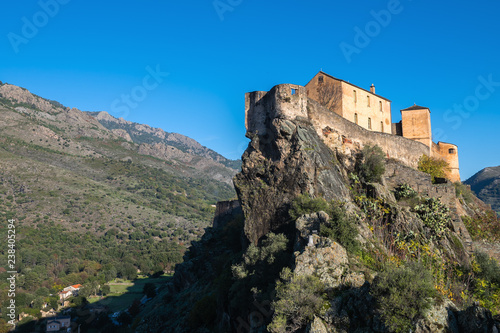 View of the historical  citadel in the Corsican city of Corte on a sunny autumn day, France © ptashkan