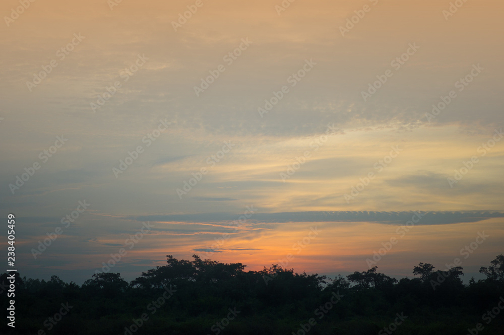 Sky and sun Blue and orange in the sky in summer.