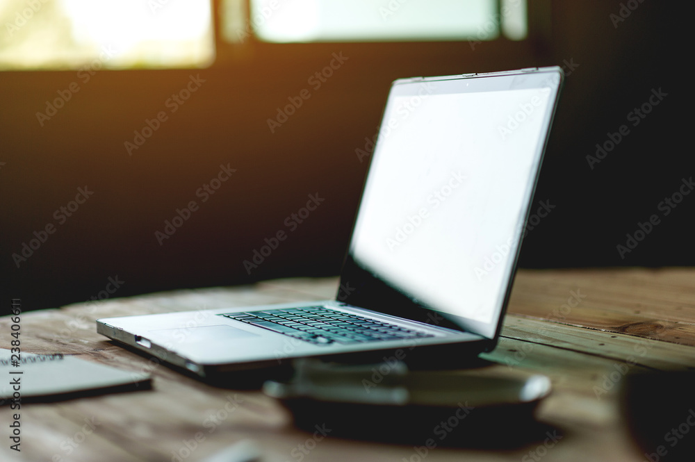 A desk with a business computer and a note on the desk. Business concept with copy space. A desk with a business computer and a note on the desk. Business concept with copy space.