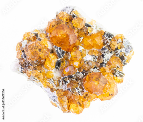 raw yellow garnet spessartine crystals on white photo