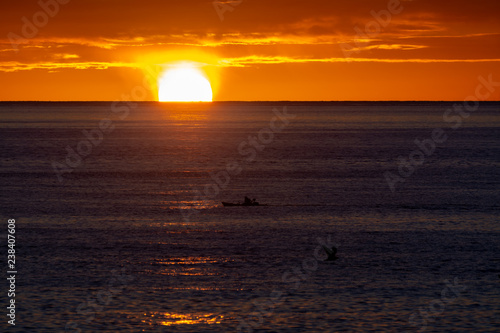 Fototapeta Naklejka Na Ścianę i Meble -  Scenic colorful sunrise over dark blue ocean water