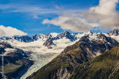 Travel New Zealand, beautiful nature/mountain background. Top scenic view of Fox Glacier Valley, Mount Cook and Southern Alps. Popular tourist/backpackers destination. © Dajahof