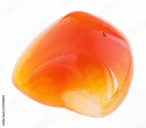 tumbled carnelian gem stone on white photo