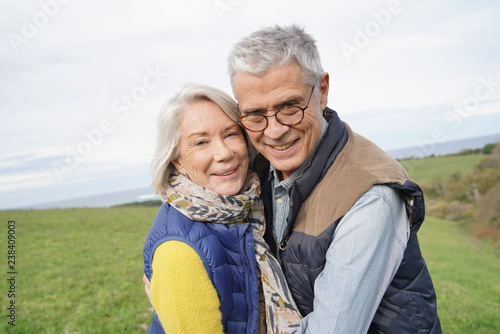  Healthy senior couple on countryside walk