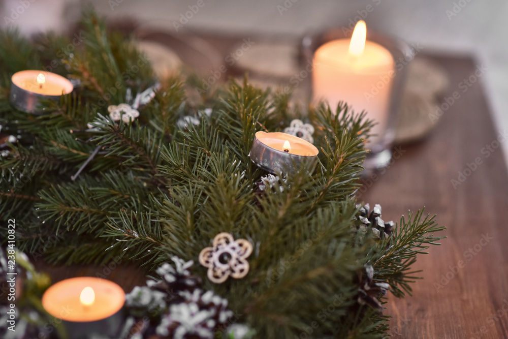 Christmas, Advent Decorative Wreath Candle Decoration. In a burning candle in a beautiful decorative wreath. Christmas, Advent Decorative Wreath Candle Decoration. In a burning candle in a beautiful decorative wreath.