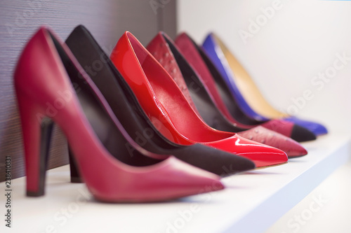 High-heeled shoes standing on the shelf.