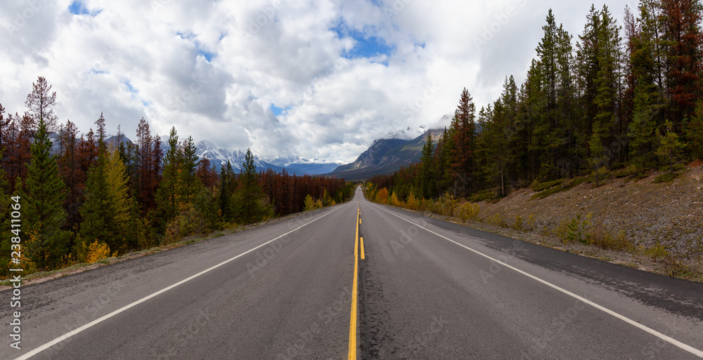 Beautiful view of a scenic road in the Canadian Rockies during Fall Season. Taken in Icefields Pkwy, Jasper, Alberta, Canada. Beautiful view of a scenic road in the Canadian Rockies during Fall Season. Taken in Icefields Pkwy, Jasper, Alberta, Canada.