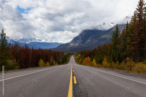 Beautiful view of a scenic road in the Canadian Rockies during Fall Season. Taken in Icefields Pkwy, Jasper, Alberta, Canada.