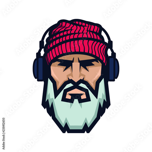 Bearded man in a knitted hat and headphones. DJ Hipster