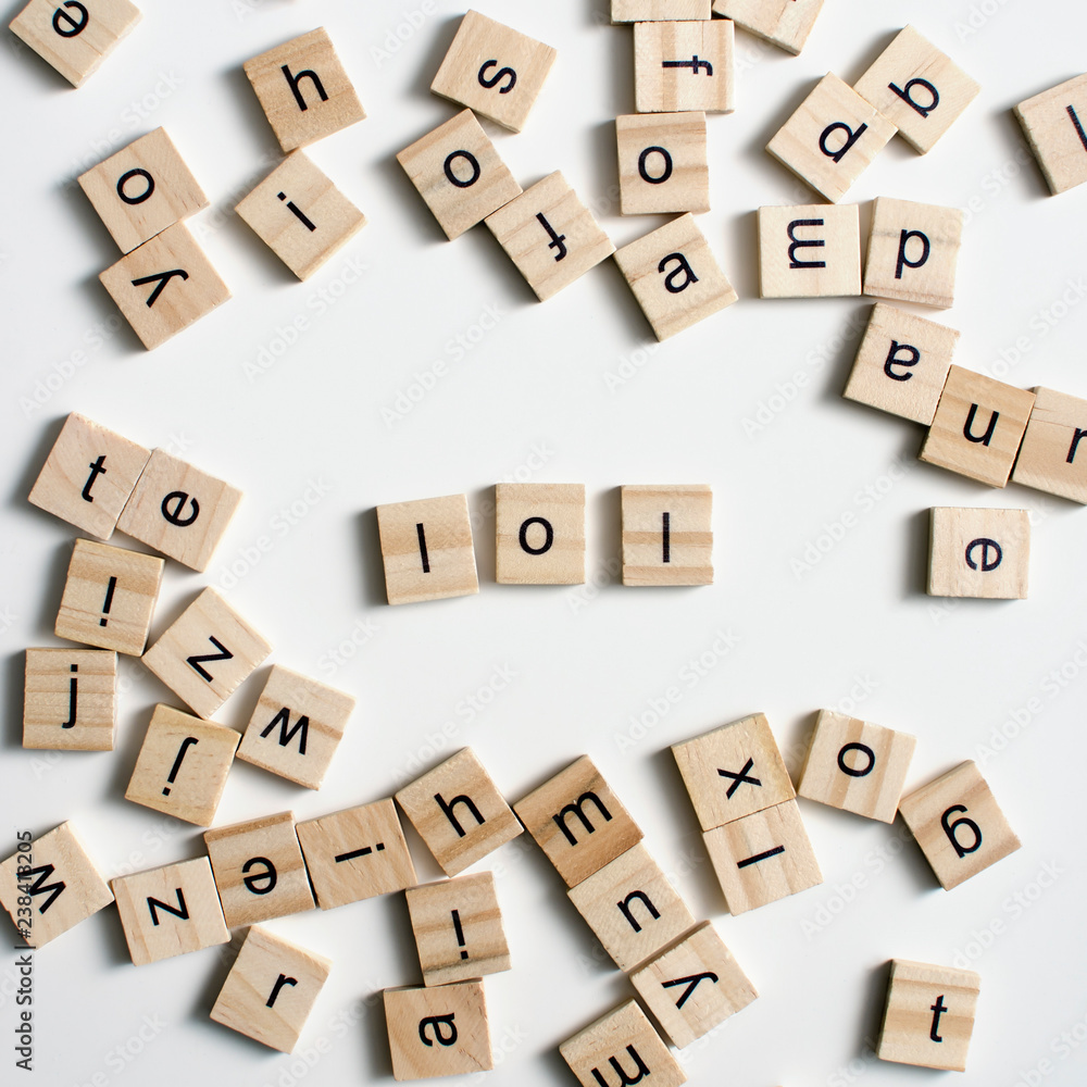 LOL - Laugh Out Loud, spelt with wooden letter tiles.