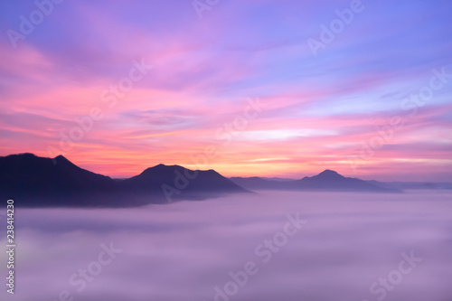 View of the mountains covered with thick fog