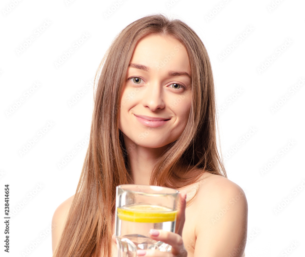 Beautiful woman a glass of water with lemon in hand health beauty on white background isolation Beautiful woman a glass of water with lemon in hand health beauty on white background isolation