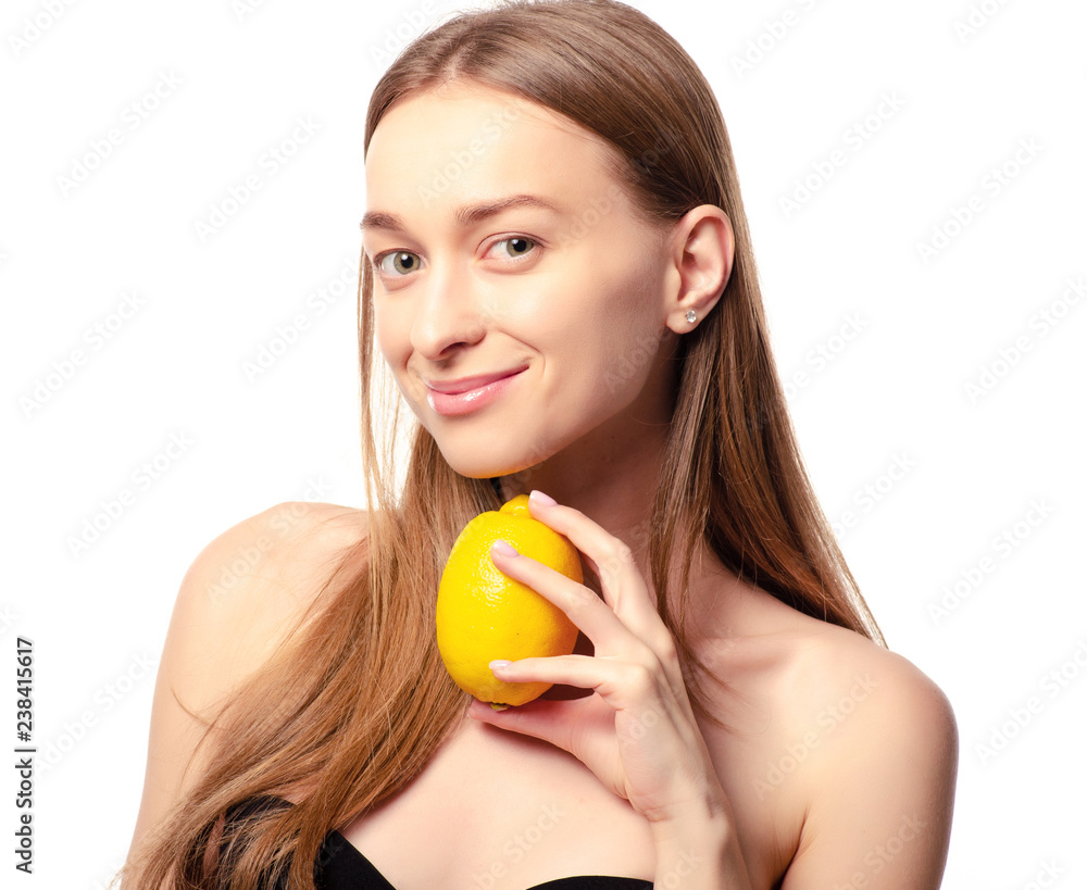 Beautiful woman with lemon beauty fashion skin freshness face on a white background. Isolation Beautiful woman with lemon beauty fashion skin freshness face on a white background. Isolation