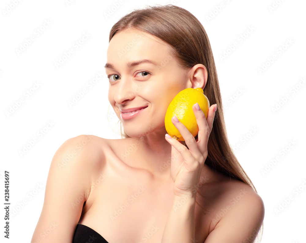 Beautiful woman with lemon beauty fashion skin freshness face on a white background. Isolation Beautiful woman with lemon beauty fashion skin freshness face on a white background. Isolation