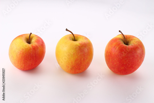 Red apples Pinova on a white background photo