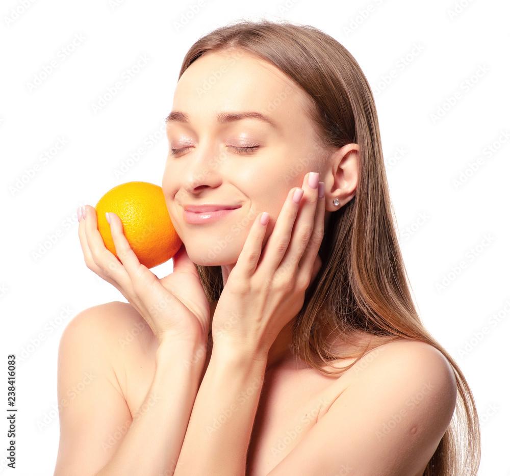 Beautiful woman orange in hand beauty fashion face on a white background. Isolation Beautiful woman orange in hand beauty fashion face on a white background. Isolation