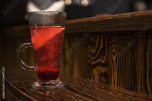 Berries tea on wooden backg...